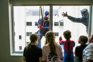 Superheroes visited pediatric patients and their families at Hoops Family Children’s Hospital (HFCH) on Friday, July 7, 2023. Employees from High Access/Central Window Cleaning, a Cleveland-based company, wore their favorite superhero suits and cleaned windows while patients and staff watched from inside. HFCH staff first hosted the superhero window washers in 2017.